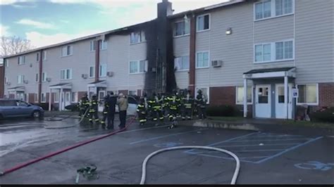 Apartment building damaged by fire after car hits gas line